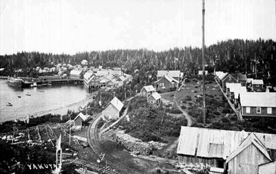 The town of Yukutat, Alaska, with the S.S. Admiral Evans, f.k.a. S.S. Buckman, docked at the cannery at left.